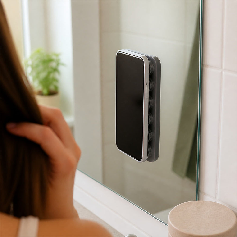 Hands-free phone mount attached to a mirror
