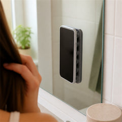 Hands-free phone mount attached to a mirror